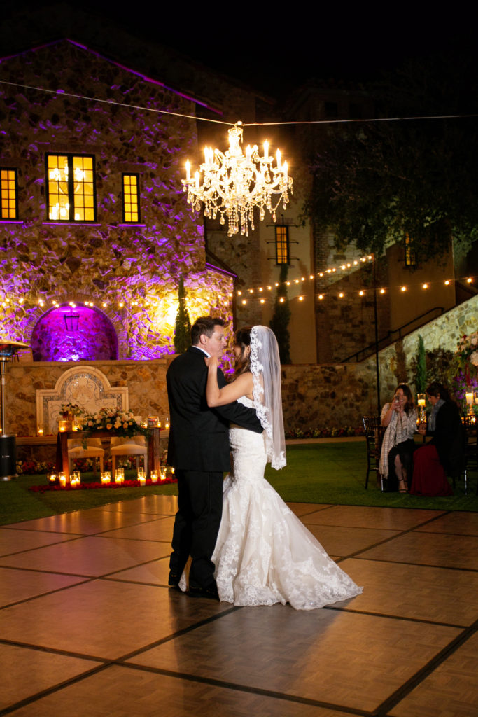 chandelier over bride groom dance