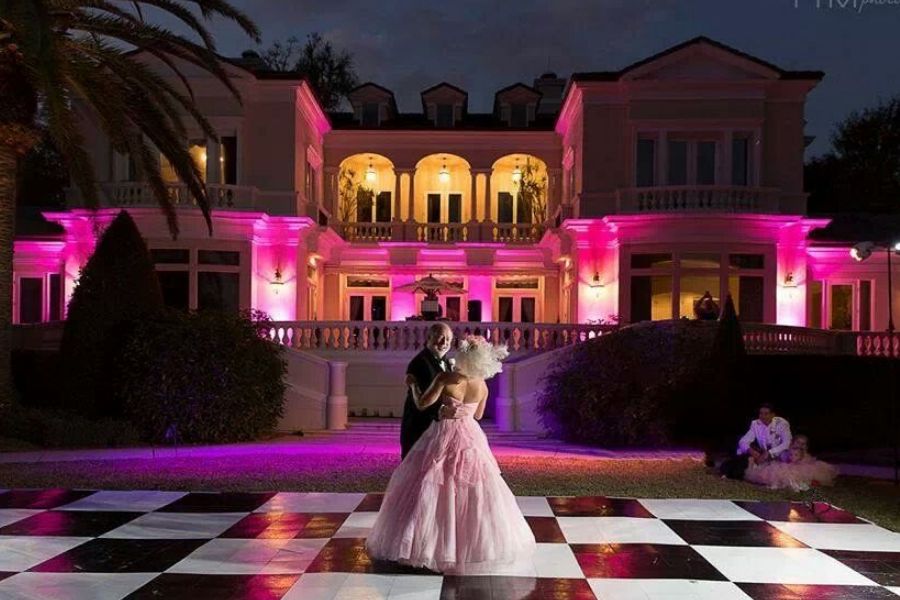 Checkerboard dance floor with bride and father dancing
