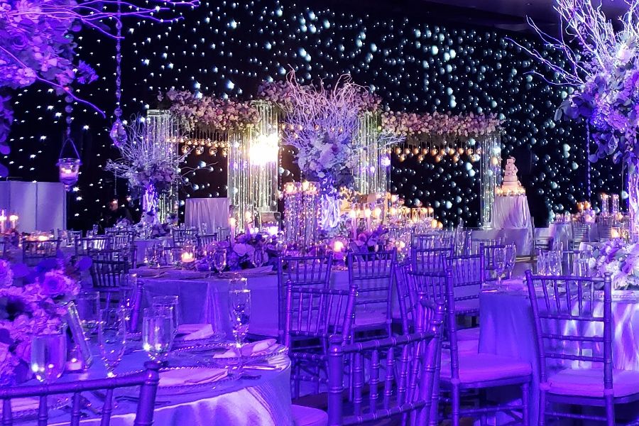 LED drapes lighting up a wedding venue